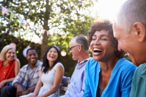 group of friends outside laughing and smiling